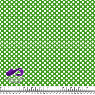 Tissu vert avec des pois blancs régulièrement espacés