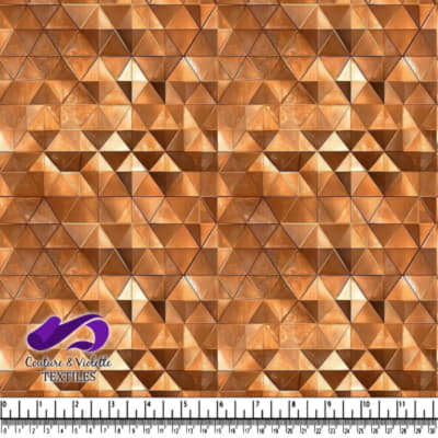 Close up of brown and beige geometric tessellated triangle fabric pattern