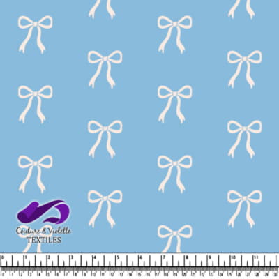 Tissu bleu avec motif de nœuds blancs