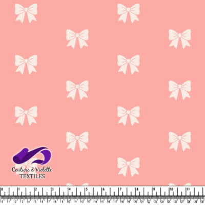Pink fabric pattern with white bows